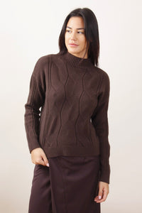 Maglione con trecce a collo alto