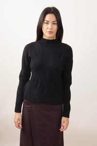 Maglione con trecce a collo alto