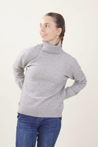 Maglione a collo alto con treccia