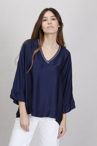 BLUSA DETTAGLI IN LUREX SCOLLO A V