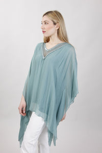 BLUSA CON MANICHE A FARFALLA